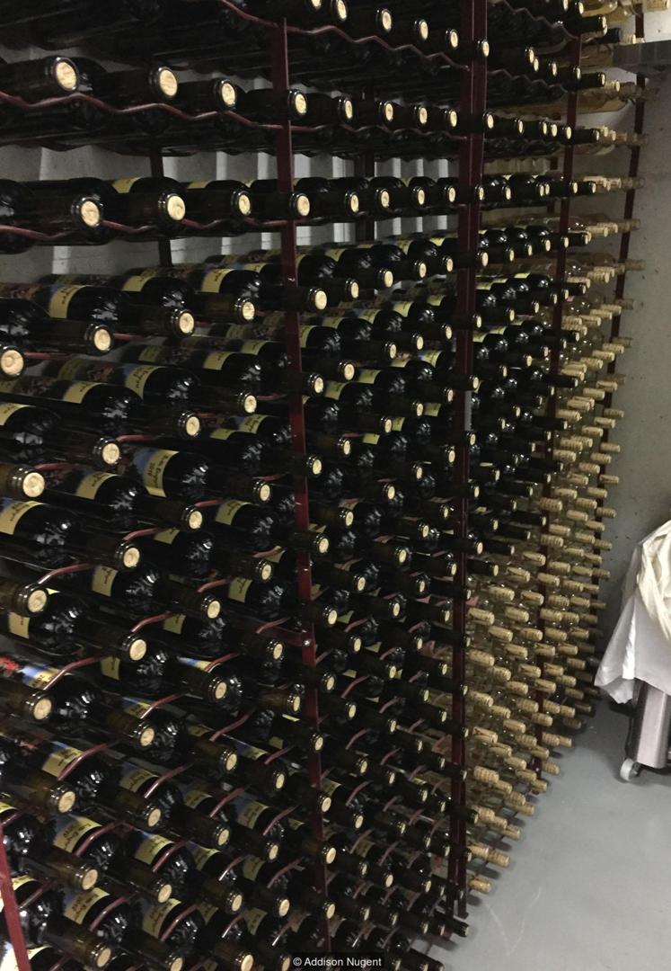 The Butte Bergeyre’s small wine cellar contains all the bottles that will be auctioned each autumn (Credit: Credit: Addison Nugent)